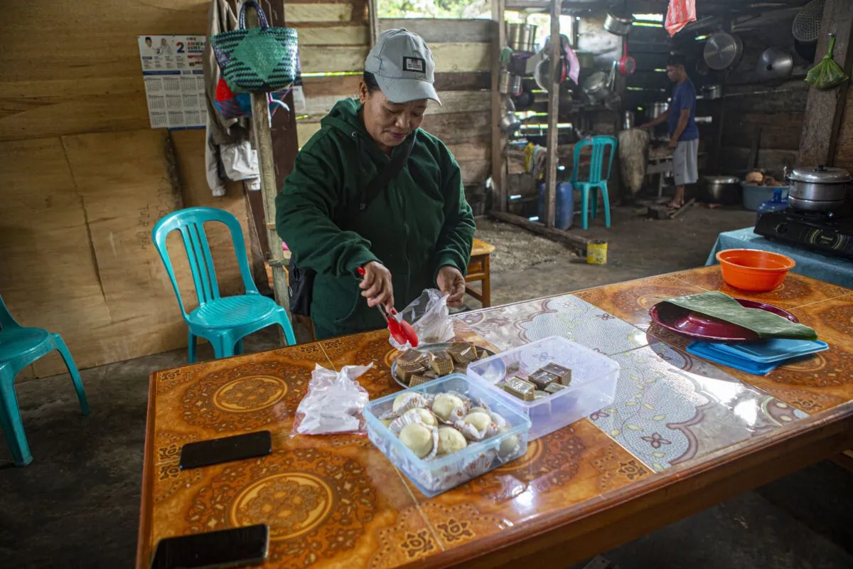 a woman handing money to a woman
